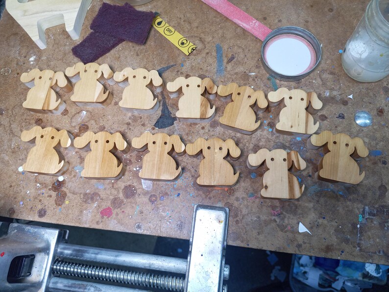 This is an unfinished wooden Puppy Dog cutout from solid wood using traditional woodworking techniques. Sanded smooth and ready to paint, stain, or customize. Freestanding design for small hands, toddlers, young children, crafters, collectors, and display. I take custom orders for any animal, quantity, and mix — including large ornament orders. Mix and match, request a different size, or send a drawing or pattern. Handmade by Odin's Toy Factory in Tallahassee, Florida, USA.