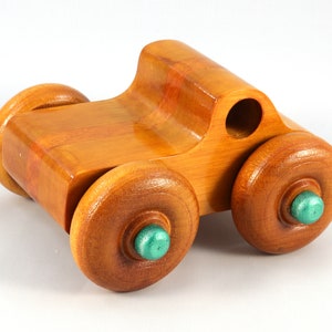Wood Toy Monster Pickup Truck handmade in the USA from select hardwood finished with amber shellac with metallic emerald green trim. From my Play Pal Collection.