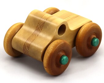 Wooden Toy Monster Pickup Truck Handmade From Laminated Hardwoods And Hand-Finished With Amber Shellac With Metallic Emerald Green Trim