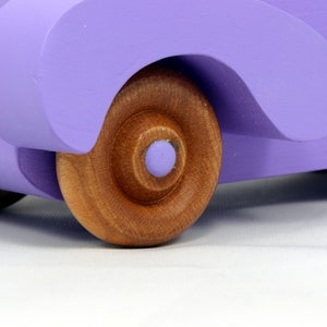 A Handmade Wood Toy Car Fat Fendered Coupe Hand Painted With Amethyst Acrylic Paint And Amber Shellac
