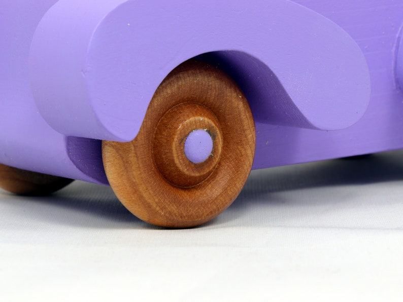 A Handmade Wood Toy Car Fat Fendered Coupe Hand Painted With Amethyst Acrylic Paint And Amber Shellac
