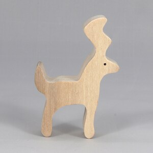 Handmade unfinished wooden deer toy figurine, part of the Itty Bitty Animal Collection, shown in natural light wood with visible grain, standing on a white background.