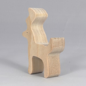 Handmade unfinished wooden deer toy figurine, part of the Itty Bitty Animal Collection, shown in natural light wood with visible grain, standing on a white background.
