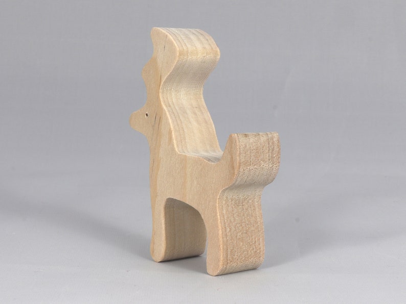 Handmade unfinished wooden deer toy figurine, part of the Itty Bitty Animal Collection, shown in natural light wood with visible grain, standing on a white background.