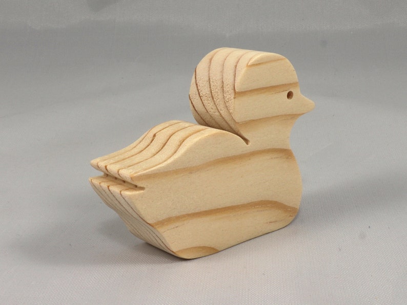 Handcrafted 2 inchwooden toy duck cutout made from 3/4-inch thick wood.