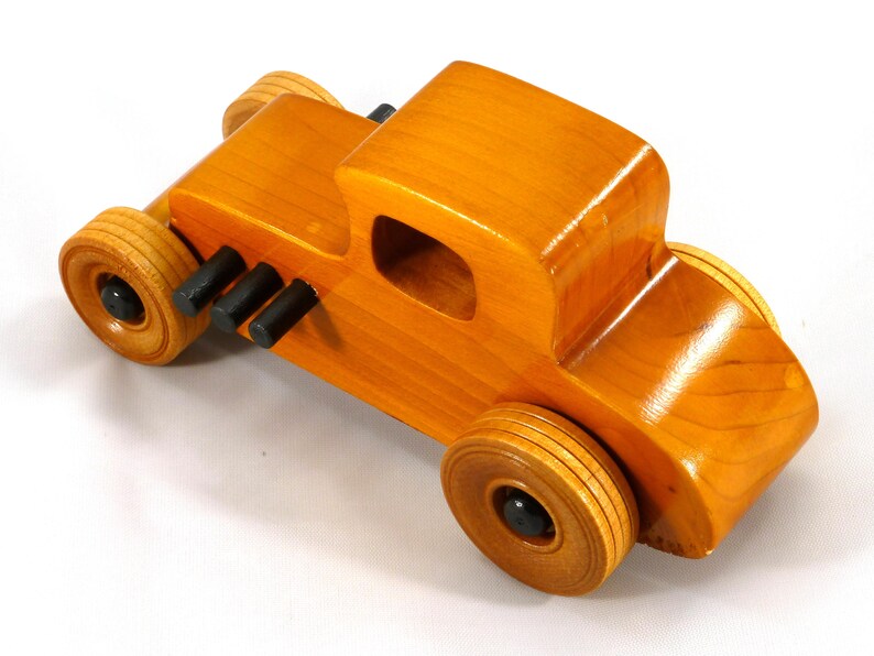 Handmade Wood Toy Car Hot Rod Based On The 1927 T-Coupe. It Has Been Hand-Finished With Multiple Coats Of Amber Shellac And Trimmed With Black Acrylic Paint.