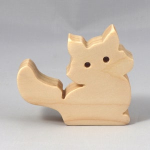 Handmade and unfinished, this stackable toy kitten cat cutout is ready to paint. This unpainted cutout is an excellent option for a fun DIY project or as a pretend toy for children. Available in several sizes, including custom orders.