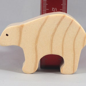 This is an unfinished wooden bear cutout from solid wood using traditional woodworking techniques. Sanded smooth and ready to paint, stain, or customize. Freestanding design for small hands, toddlers, young children, crafters, collectors, and display. I take custom orders for any animal, quantity, and mix — including large ornament orders. Mix and match, request a different size, or send a drawing or pattern. Handmade by Odin's Toy Factory in Tallahassee, Florida, USA.