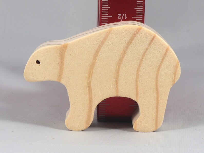 This is an unfinished wooden bear cutout from solid wood using traditional woodworking techniques. Sanded smooth and ready to paint, stain, or customize. Freestanding design for small hands, toddlers, young children, crafters, collectors, and display. I take custom orders for any animal, quantity, and mix — including large ornament orders. Mix and match, request a different size, or send a drawing or pattern. Handmade by Odin's Toy Factory in Tallahassee, Florida, USA.