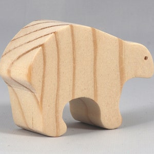 This is an unfinished wooden bear cutout from solid wood using traditional woodworking techniques. Sanded smooth and ready to paint, stain, or customize. Freestanding design for small hands, toddlers, young children, crafters, collectors, and display. I take custom orders for any animal, quantity, and mix — including large ornament orders. Mix and match, request a different size, or send a drawing or pattern. Handmade by Odin's Toy Factory in Tallahassee, Florida, USA.