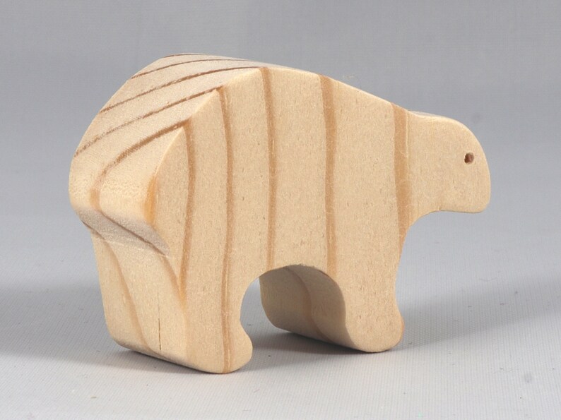 This is an unfinished wooden bear cutout from solid wood using traditional woodworking techniques. Sanded smooth and ready to paint, stain, or customize. Freestanding design for small hands, toddlers, young children, crafters, collectors, and display. I take custom orders for any animal, quantity, and mix — including large ornament orders. Mix and match, request a different size, or send a drawing or pattern. Handmade by Odin's Toy Factory in Tallahassee, Florida, USA.