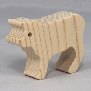 This is an unfinished wooden Calf cutout from solid wood using traditional woodworking techniques. Sanded smooth and ready to paint, stain, or customize. Freestanding design for small hands, toddlers, young children, crafters, collectors, and display. I take custom orders for any animal, quantity, and mix — including large ornament orders. Mix and match, request a different size, or send a drawing or pattern. Handmade by Odin's Toy Factory in Tallahassee, Florida, USA.