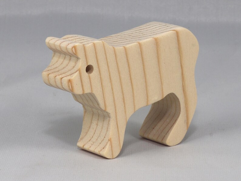 This is an unfinished wooden Calf cutout from solid wood using traditional woodworking techniques. Sanded smooth and ready to paint, stain, or customize. Freestanding design for small hands, toddlers, young children, crafters, collectors, and display. I take custom orders for any animal, quantity, and mix — including large ornament orders. Mix and match, request a different size, or send a drawing or pattern. Handmade by Odin's Toy Factory in Tallahassee, Florida, USA.