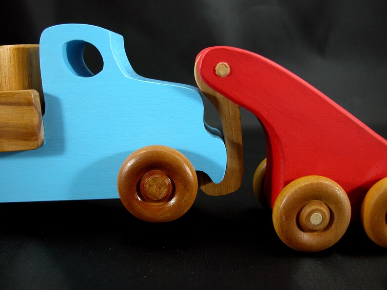 This handmade wooden Lorry truck is finished with navy blue acrylic paint and Amber Shellac. It is one of five towable trucks in this collection, available in many colors and unfinished. Custom Orders are welcome.