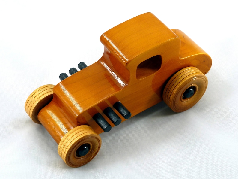 Handmade Wood Toy Car Hot Rod Based On The 1927 T-Coupe. It Has Been Hand-Finished With Multiple Coats Of Amber Shellac And Trimmed With Black Acrylic Paint.