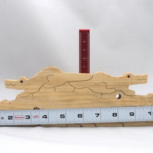 Handmade Wood Alligator Family Stacking Puzzle Mom and five baby (hatchling) alligators. This freestanding puzzle is hand-finished with a custom blend of mineral oil and waxes for a beautiful, smooth, and durable finish.