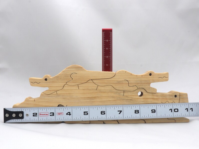 Handmade Wood Alligator Family Stacking Puzzle Mom and five baby (hatchling) alligators. This freestanding puzzle is hand-finished with a custom blend of mineral oil and waxes for a beautiful, smooth, and durable finish.