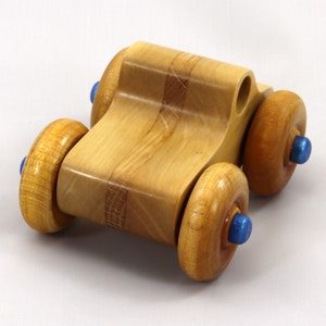 Handmade wooden toy pickup truck with a durable satin polyurethane finish and metallic sapphire blue trim from My Play Pal collection.