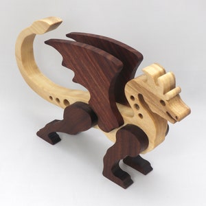Handmade wood dragon figurine made from select grade contrasting hardwoods and hand-finished with a custom mixture of mineral oil and waxes.