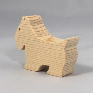 Handmade wood toy Scottie dog cutout unfinished unpainted paintable freestanding Itty Bitty Animal Collection. Approximate size 2.5 inches length by 2 inches height by 0.75 inches width. Handmade in Tallahassee Florida USA from natural wood offcuts.