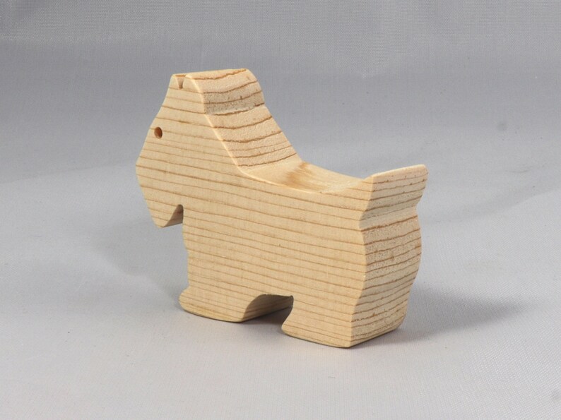 Handmade wood toy Scottie dog cutout unfinished unpainted paintable freestanding Itty Bitty Animal Collection. Approximate size 2.5 inches length by 2 inches height by 0.75 inches width. Handmade in Tallahassee Florida USA from natural wood offcuts.