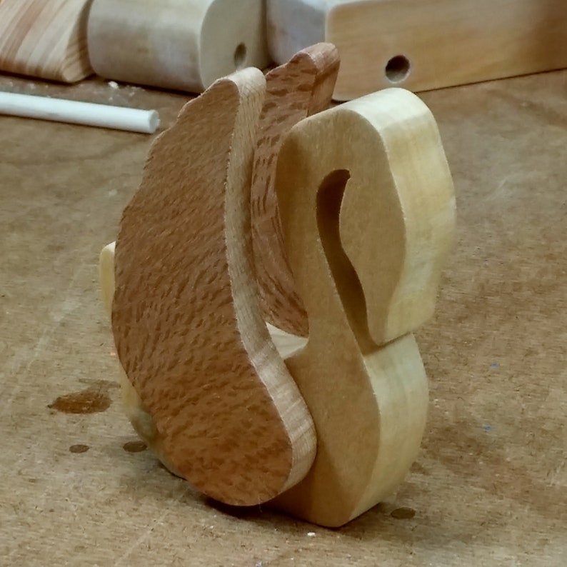 Handmade wooden swan figurine crafted from contrasting reclaimed hardwoods, sanded and ready to finish, and made in the USA.