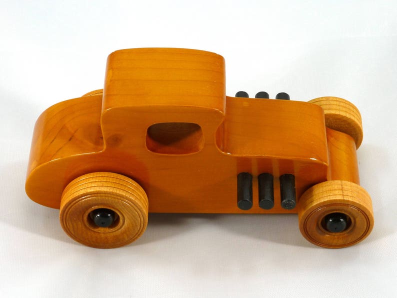 Handmade Wood Toy Car Hot Rod Based On The 1927 T-Coupe. It Has Been Hand-Finished With Multiple Coats Of Amber Shellac And Trimmed With Black Acrylic Paint.