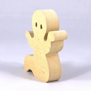 A handmade, unpainted wooden ghost cutout stands upright on a white background. The light-colored solid wood figure has a rounded head with two circular eye cutouts, raised wavy arms, and a curved wavy base, ready for painting or crafting.