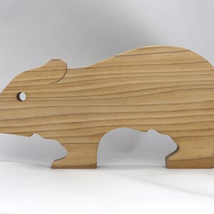 Handmade Wooden Stacking Puzzle Guinea Pig Family, Mom, and Babies finished with a non-toxic custom blend of mineral oil and waxes. This wooden toy animal is perfect for imaginative play and an excellent gift for children.