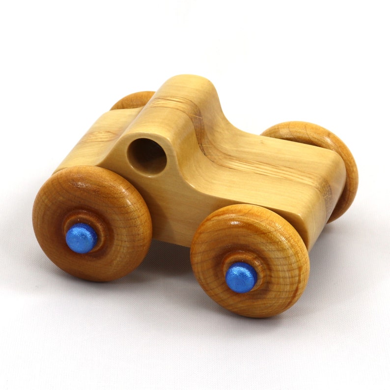 Handmade wooden toy pickup truck with a durable satin polyurethane finish and metallic sapphire blue trim from My Play Pal collection.