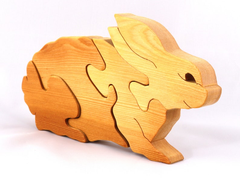 A wooden four piece puzzle in the shape of a rabbit. Perfect toddlers first puzzle.