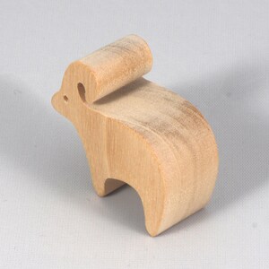This is an unfinished wooden Ram cutout from solid wood using traditional woodworking techniques. Sanded smooth and ready to paint, stain, or customize. Freestanding design for small hands, toddlers, young children, crafters, collectors, and display. I take custom orders for any animal, quantity, and mix — including large ornament orders. Mix and match, request a different size, or send a drawing or pattern. Handmade by Odin's Toy Factory in Tallahassee, Florida, USA.