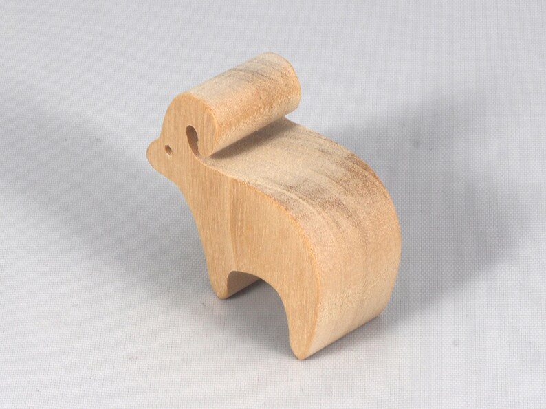 This is an unfinished wooden Ram cutout from solid wood using traditional woodworking techniques. Sanded smooth and ready to paint, stain, or customize. Freestanding design for small hands, toddlers, young children, crafters, collectors, and display. I take custom orders for any animal, quantity, and mix — including large ornament orders. Mix and match, request a different size, or send a drawing or pattern. Handmade by Odin's Toy Factory in Tallahassee, Florida, USA.