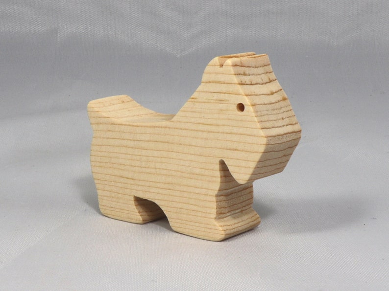 Handmade wood toy Scottie dog cutout unfinished unpainted paintable freestanding Itty Bitty Animal Collection. Approximate size 2.5 inches length by 2 inches height by 0.75 inches width. Handmade in Tallahassee Florida USA from natural wood offcuts.
