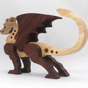 Handmade wood dragon figurine made from select grade contrasting hardwoods and hand-finished with a custom mixture of mineral oil and waxes.