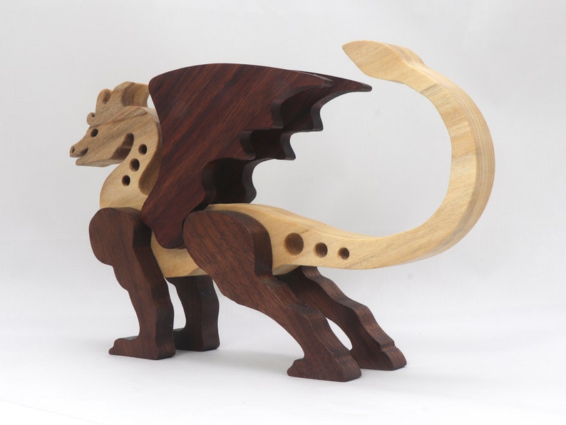 Handmade wood dragon figurine made from select grade contrasting hardwoods and hand-finished with a custom mixture of mineral oil and waxes.