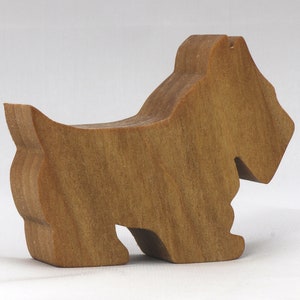Handmade wooden Scottie dog toy cutout finished with mineral oil and beeswax blend. Freestanding stackable design from my Itty Bitty Animal Collection. Handcrafted in Tallahassee, Florida, USA from quality hardwood. Approximate size: length 2-1/2 inches, height 2 inches, width 3/4 inch. Each piece is unique with natural wood grain variations.