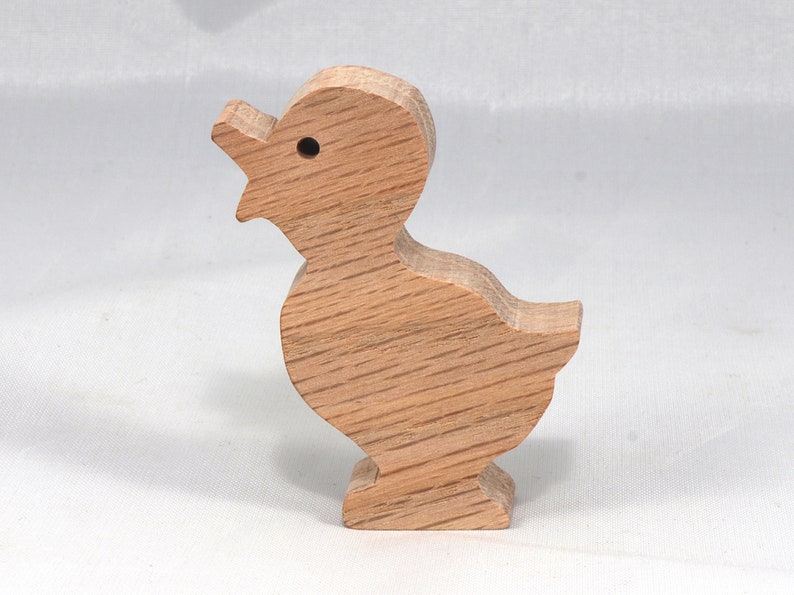 Wooden duck cutout, handmade, unfinished, and unpainted, from the Itty Bitty Animal Collection. Natural wood, freestanding, stackable, and paintable. Suitable for crafts or toys, American-made