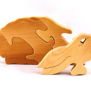 A wooden four piece puzzle in the shape of a rabbit. Perfect toddlers first puzzle.
