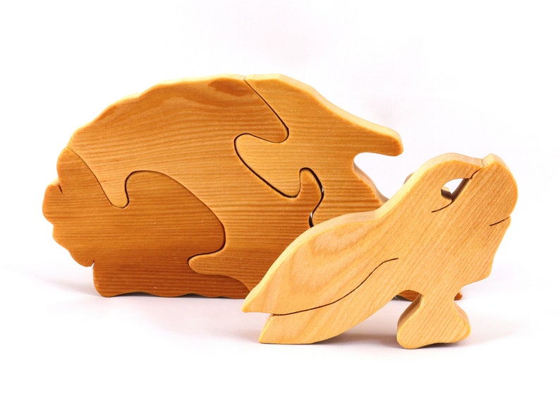 A wooden four piece puzzle in the shape of a rabbit. Perfect toddlers first puzzle.
