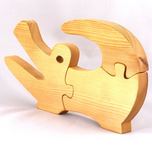 A 10-inch long wooden alligator puzzle for younger kids handmade and smoothly finished. This simple puzzle has three pieces, easy-to-grasp, interlocking, chunky, freestanding pieces. It is made to order.