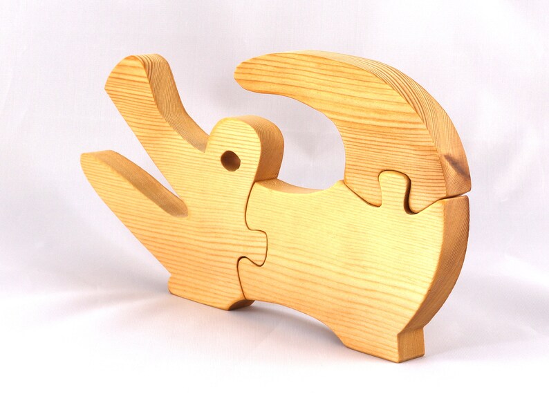 A 10-inch long wooden alligator puzzle for younger kids handmade and smoothly finished. This simple puzzle has three pieces, easy-to-grasp, interlocking, chunky, freestanding pieces. It is made to order.