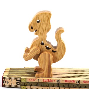 Wooden baby dinosaur figurine from My Buddies Dinos collection. Handmade with select grade hardwoods and finished with mineral oil and beeswax.