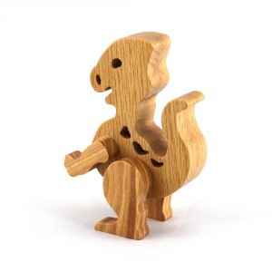 Wooden baby dinosaur figurine from My Buddies Dinos collection. Handmade with select grade hardwoods and finished with mineral oil and beeswax.
