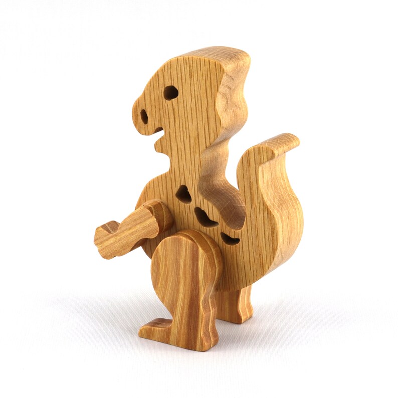 Wooden baby dinosaur figurine from My Buddies Dinos collection. Handmade with select grade hardwoods and finished with mineral oil and beeswax.