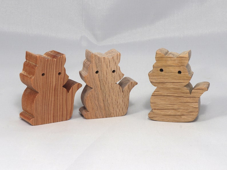 Handmade wood toy kitten cutout made from unfinished wood. It is sanded and ready to paint. It is freestanding and an excellent pretend toy that can also be used for crafts.