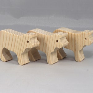 Handmade unfinished wooden toy baby calf cutout, unpainted and ready to paint, freestanding farm animal figure from Odin's Toy Factory’s  Itty Bitty Animal Collection. Handcrafted in Tallahassee, Florida, USA, using reclaimed natural wood offcuts. Perfect for imaginative play, stacking, collectors, and crafting.