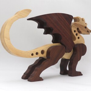 Handmade wood dragon figurine made from select grade contrasting hardwoods and hand-finished with a custom mixture of mineral oil and waxes.