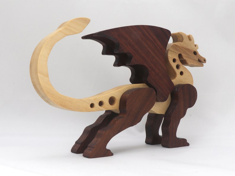 Handmade wood dragon figurine made from select grade contrasting hardwoods and hand-finished with a custom mixture of mineral oil and waxes.