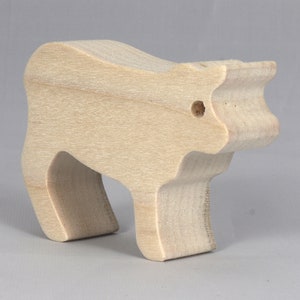Handmade unfinished wooden toy baby calf cutout, unpainted and ready to paint, freestanding farm animal figure from Odin's Toy Factory’s  Itty Bitty Animal Collection. Handcrafted in Tallahassee, Florida, USA, using reclaimed natural wood offcuts. Perfect for imaginative play, stacking, collectors, and crafting.